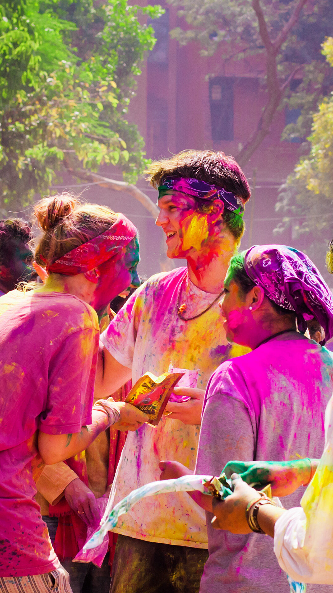 family enjoying colourfull holi at home